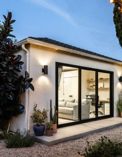 A small backyard with a patio and lights.