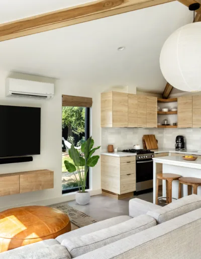 A kitchen and living room in a tiny house.